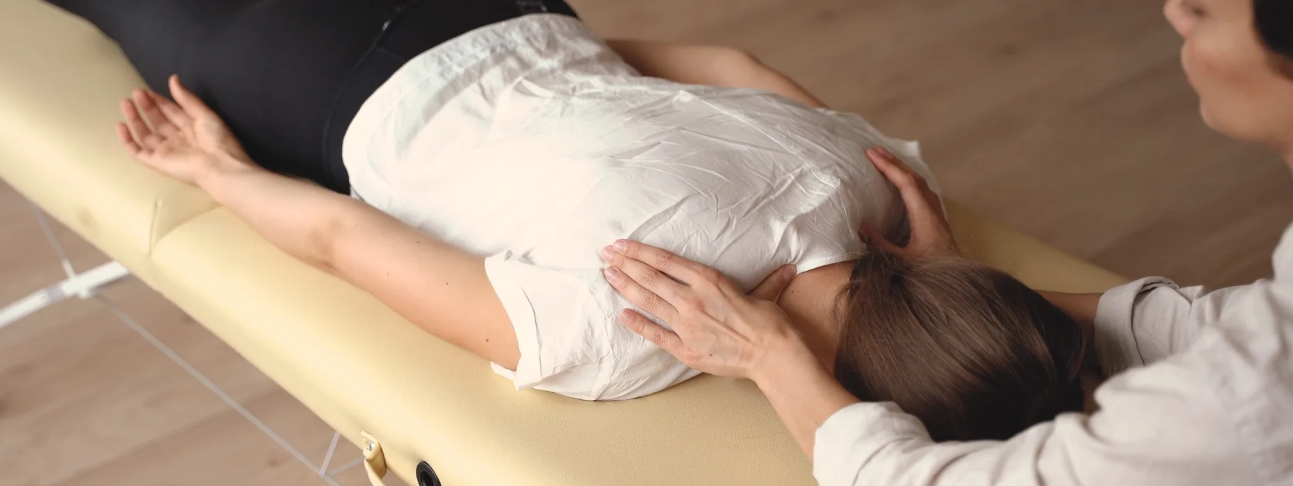 A chiropractor providing a gentle, hands-on adjustment at Momentum Chiropractic